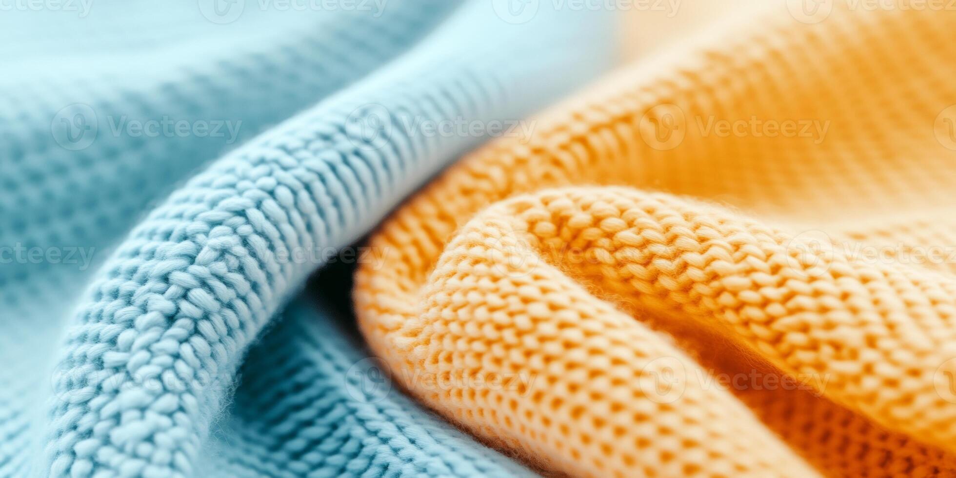 Close-up view of cozy fabric texture in light blue and sand tones under soft lighting photo