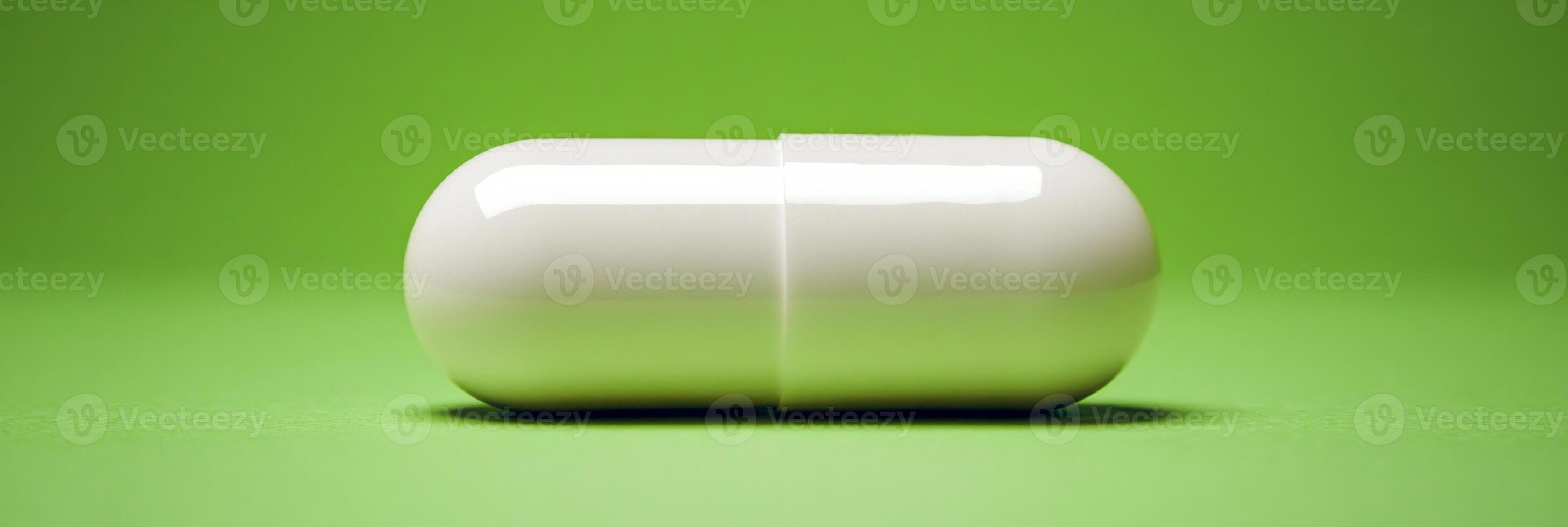 A large white capsule displayed on a pastel green background in a clean and modern setting for healthcare themes photo