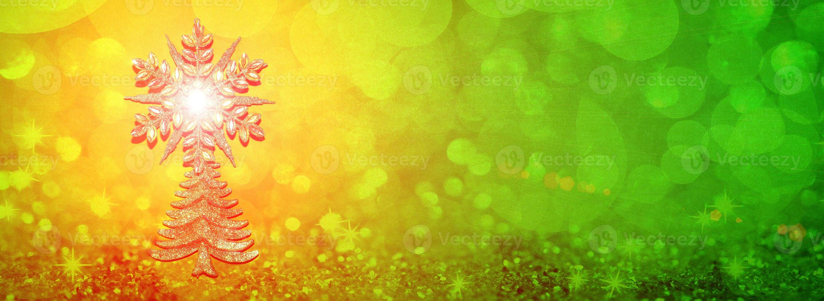 Christmas ecological tree, Christmas tree with a sparkling star against the background of yellow and green festive bokeh photo
