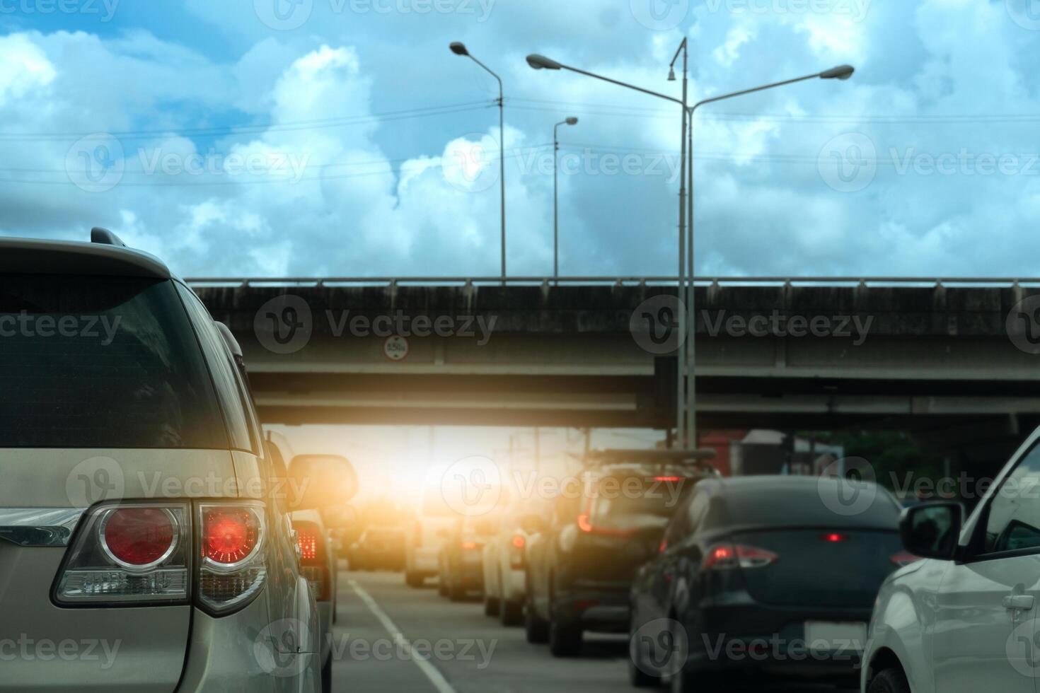 Luxury of car stop on the road junction by traffic light control in across. Traveling in the provinces during the bright period. Open light brake. Concrete bridge crossing level intersection. photo