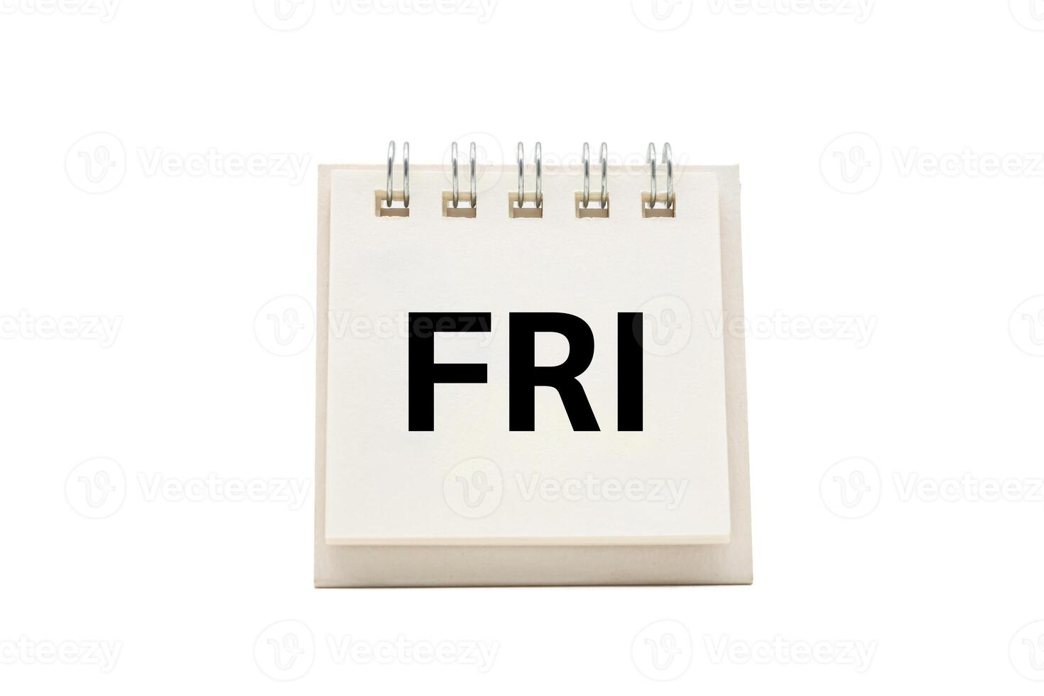 FRI text on desk calendar with clipping path isolated on white background. FRIDAY and Calendar concept photo