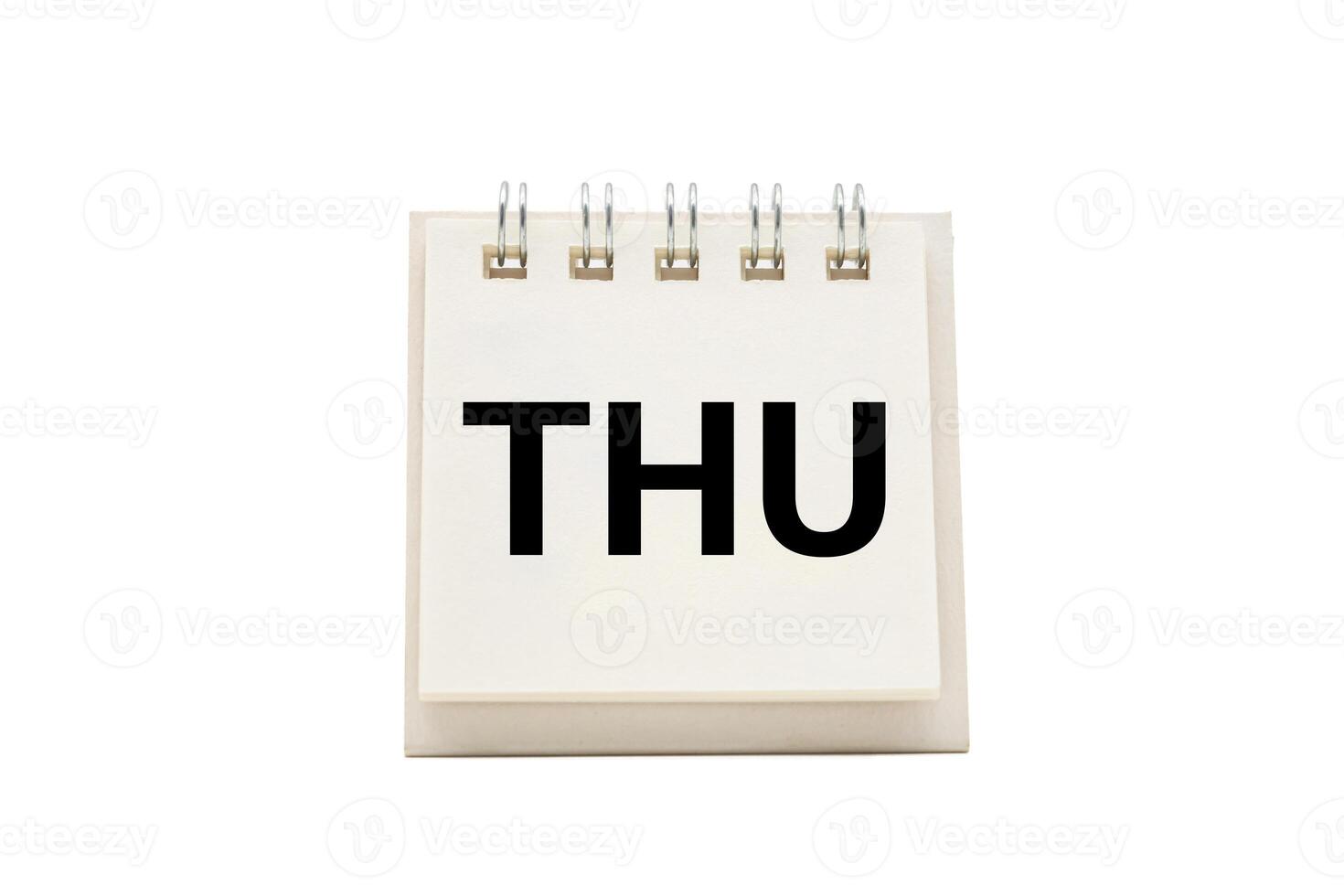 THU text on desk calendar with clipping path isolated on white background. THURSDAY and Calendar concept. photo