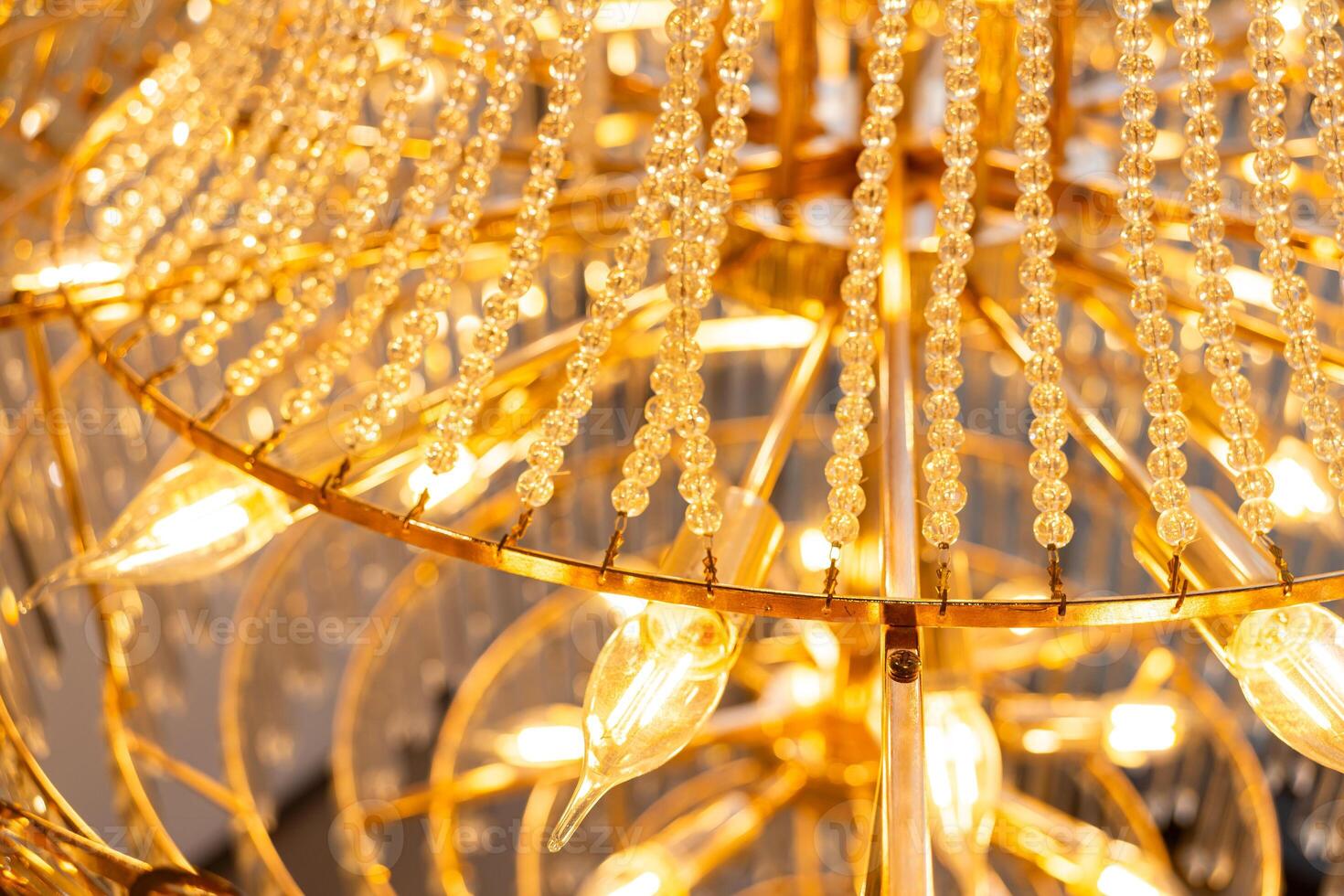 Close-up of crystal on the chandelier. Luxury crystal chandelier. Abstract background photo