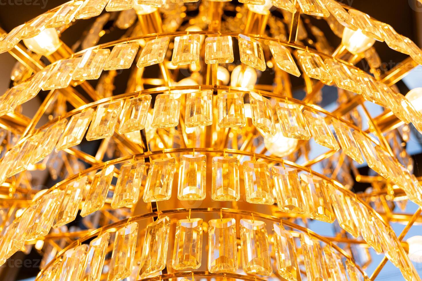 Close-up of crystal on the chandelier. Luxury crystal chandelier. Abstract background photo