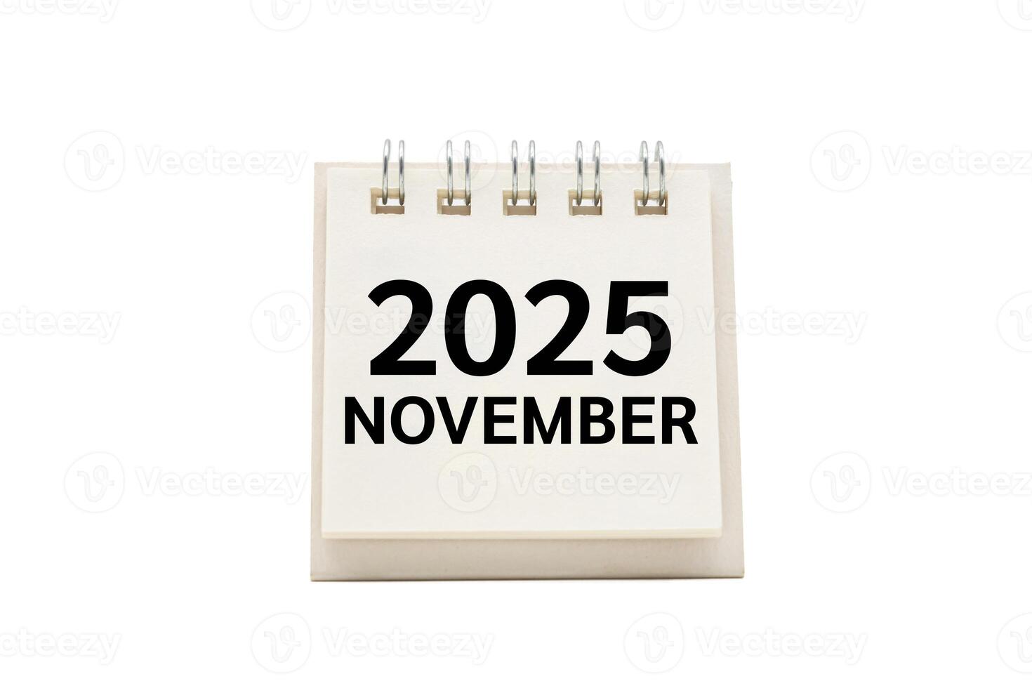 2025 NOV text on desk calendar with clipping path isolated on white background. 2025 NOVEMBER and Calendar concept. photo