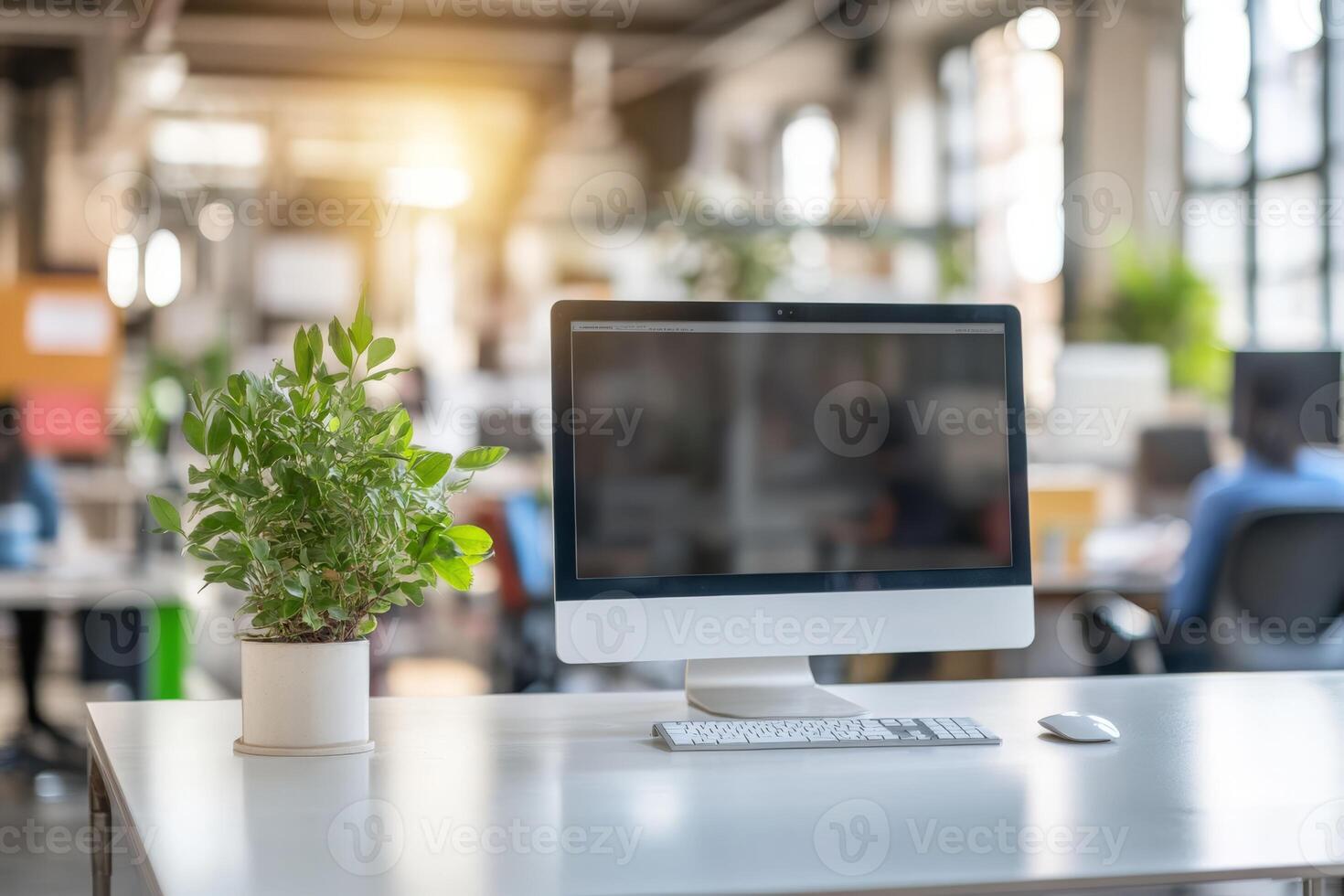 Picture a modern office with a neat desk, a sleek computer setup, and a vibrant potted plant, creating a professional environment that boosts productivity and focus for all who enter photo