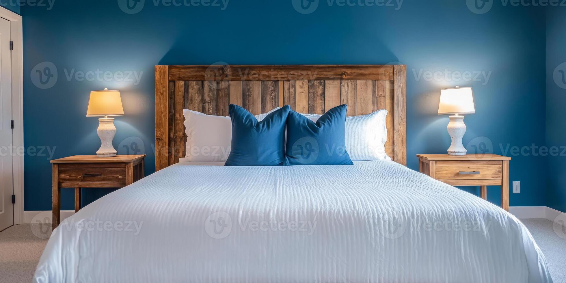 This tranquil bedroom features a luxurious white bed against elegant teal walls, with a rustic headboard, stylish lamps, and minimalistic decor, creating an ideal haven for relaxation photo