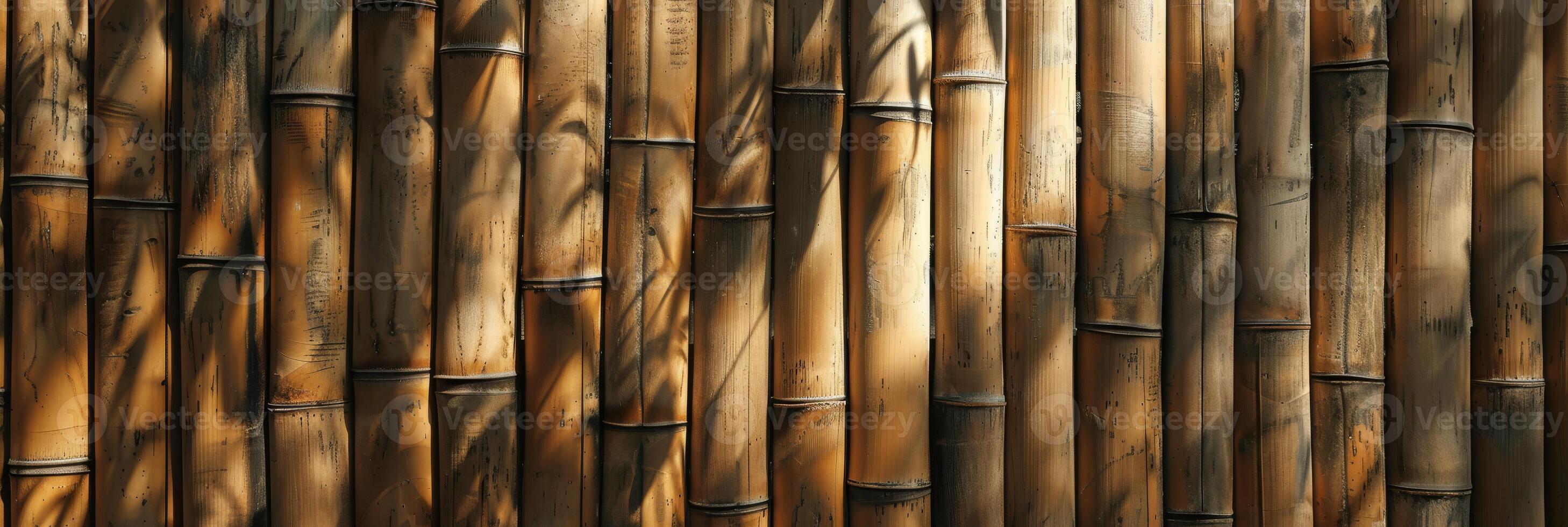 A visually striking bamboo wall that beautifully showcases natural textures along with dynamic light shadows photo