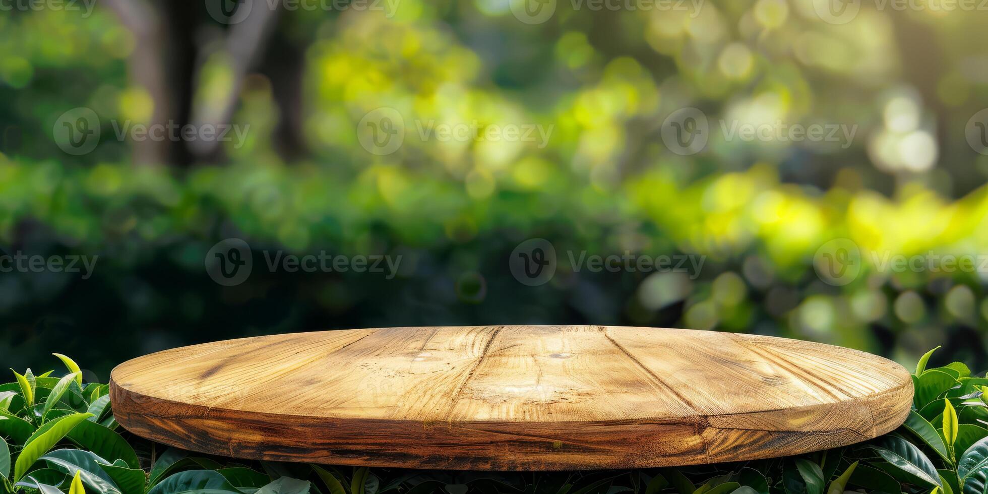 A rustic wooden table elegantly positioned against a vibrant green backdrop, ideal for showcasing product displays photo