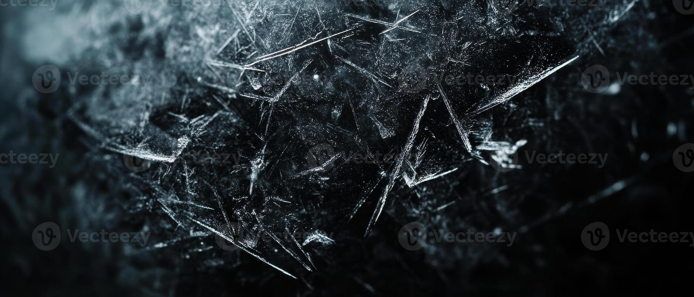 A stunning closeup of a frosty polycarbonate surface intricately displays numerous tiny ice crystals, collectively creating a truly enchanting winter scene that captivates and delights the senses photo