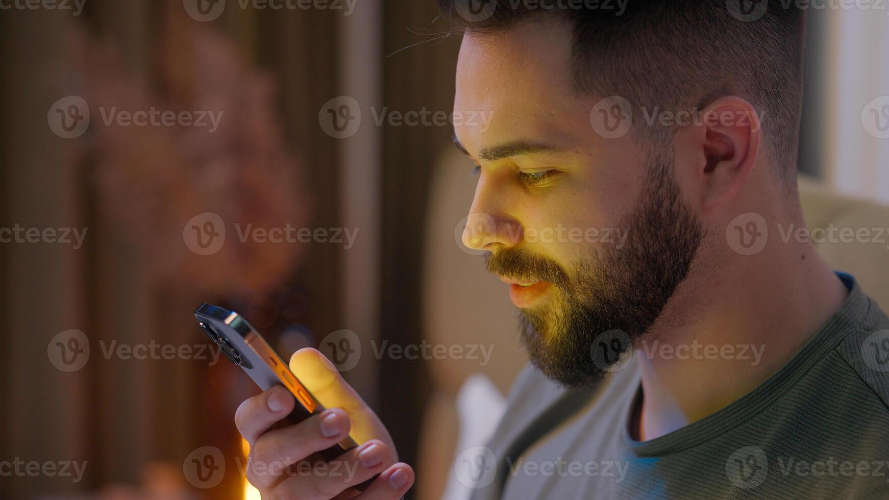 Caucasian man user mobile phone smartphone cellphone telephone guy male late night gadget cyber ecommerce touchscreen network online distance connected insomnia addicted stuck timelapse bedroom bed photo