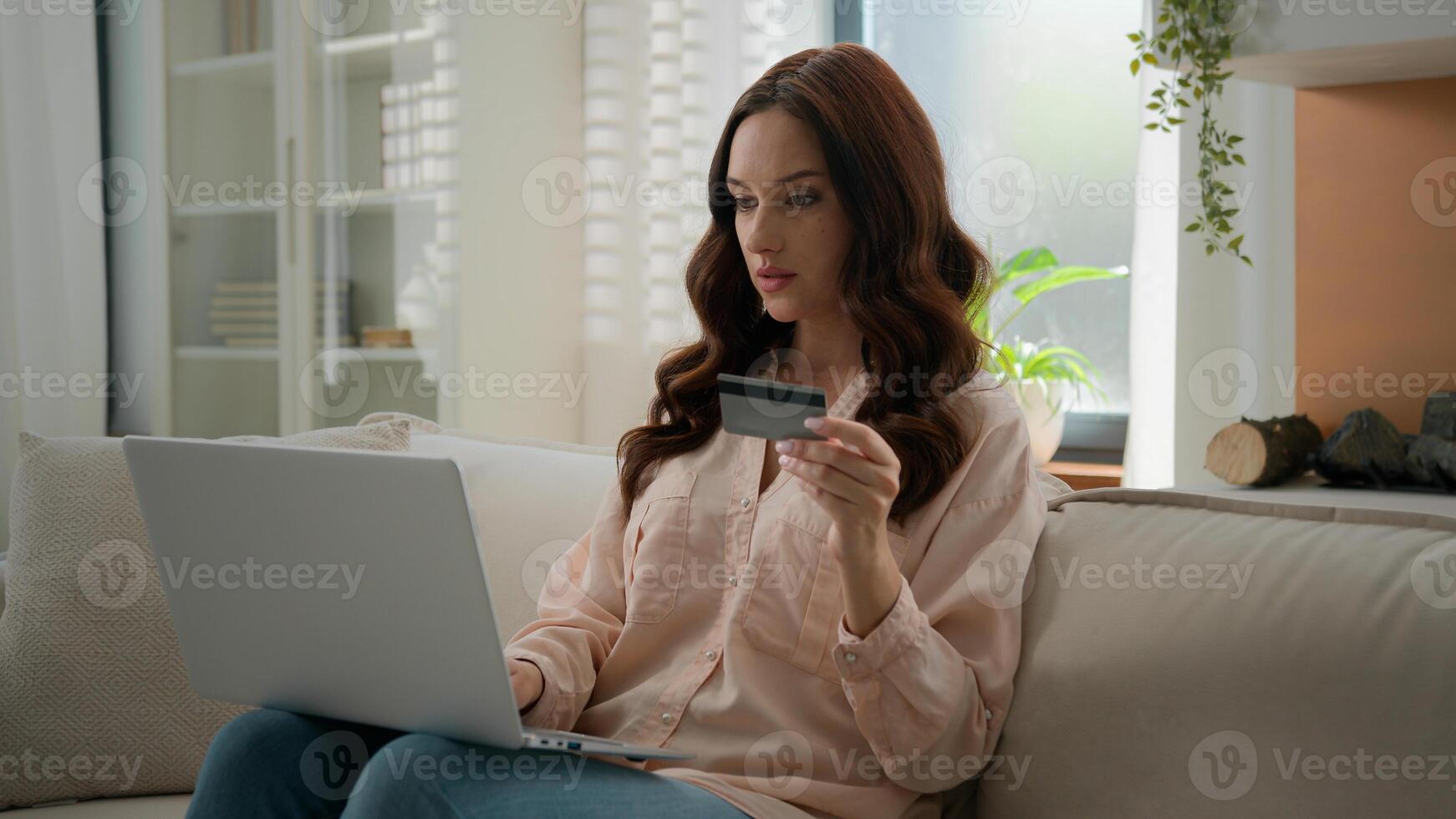 Caucasian girl has problem difficulties with internet bank irritated woman angry female at home hold credit card use laptop computer app try to pay online invalid number error unsuccessful transaction photo