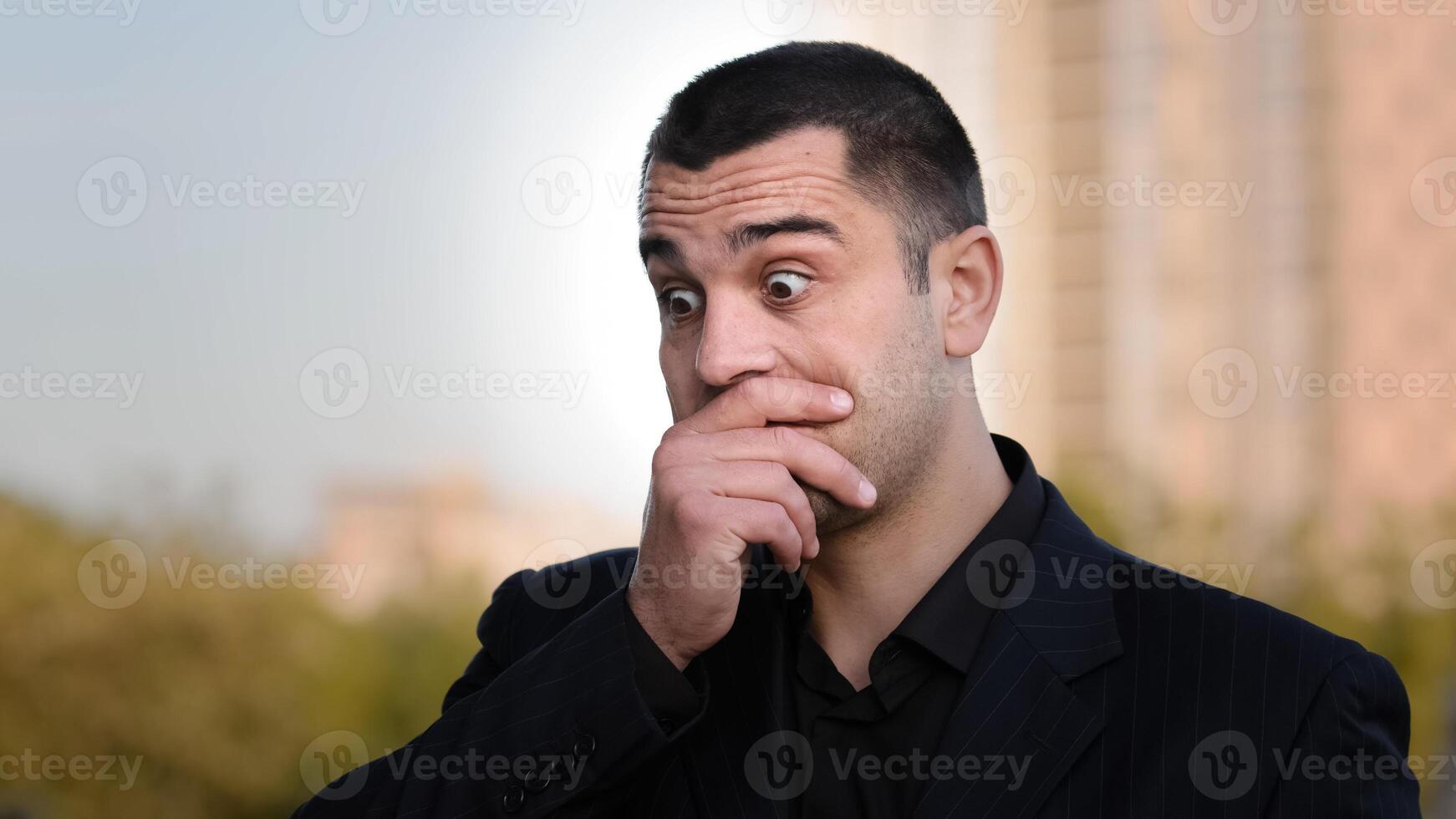 Disappointed hispanic caucasian loser businessman has financial problem covers face with hand feeling stress frustration experiencing unpleasant sadness facial emotion problem puts palm on head shame photo