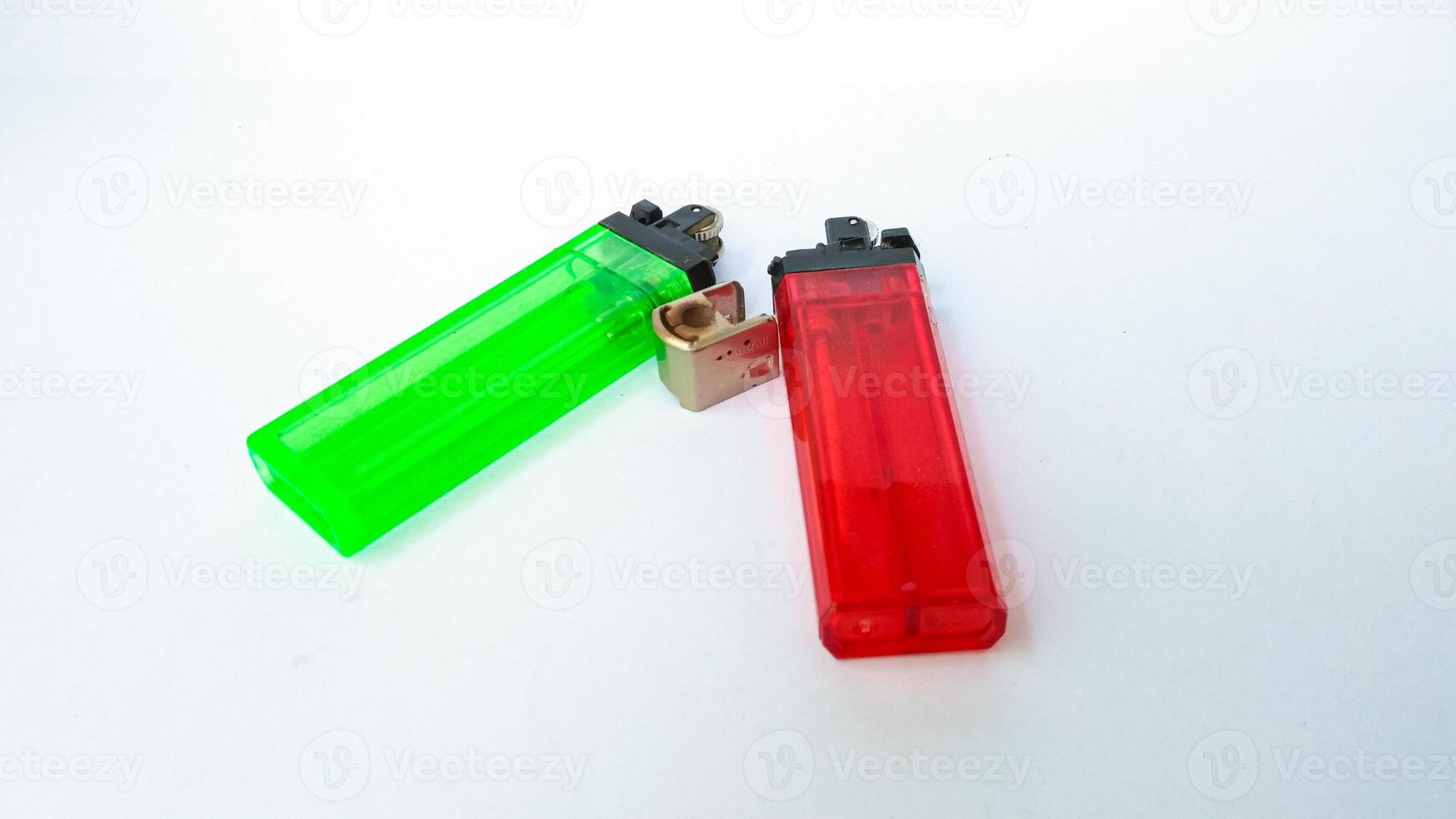 2 broken gas lighters with isolated white background photo