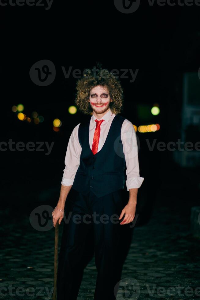 A mysterious figure, disguised as an assassin in a suit with wild hair, wields a menacing axe, embodying the very essence of fear and danger photo