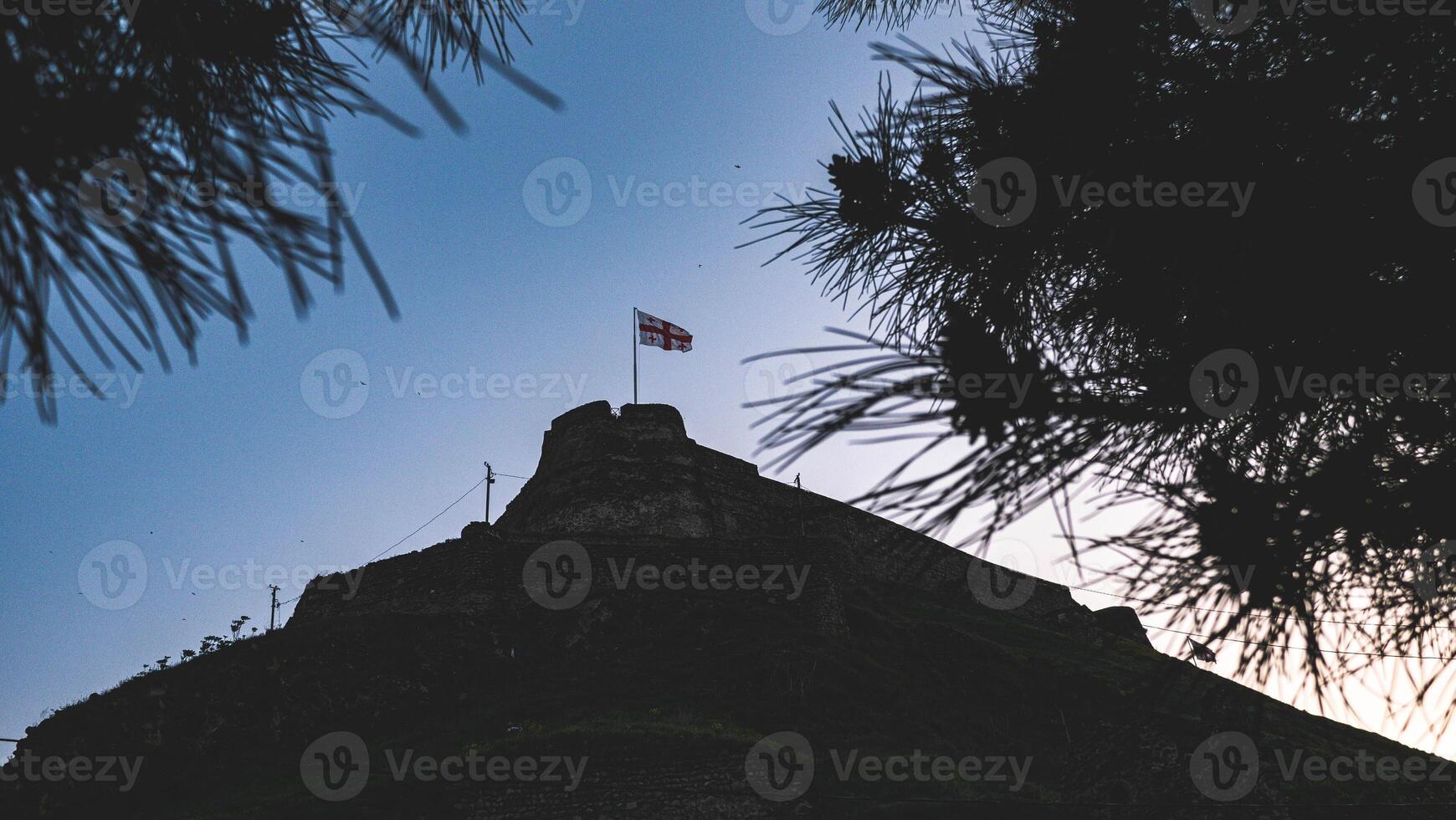 Georgian flag with nature landscape background photo
