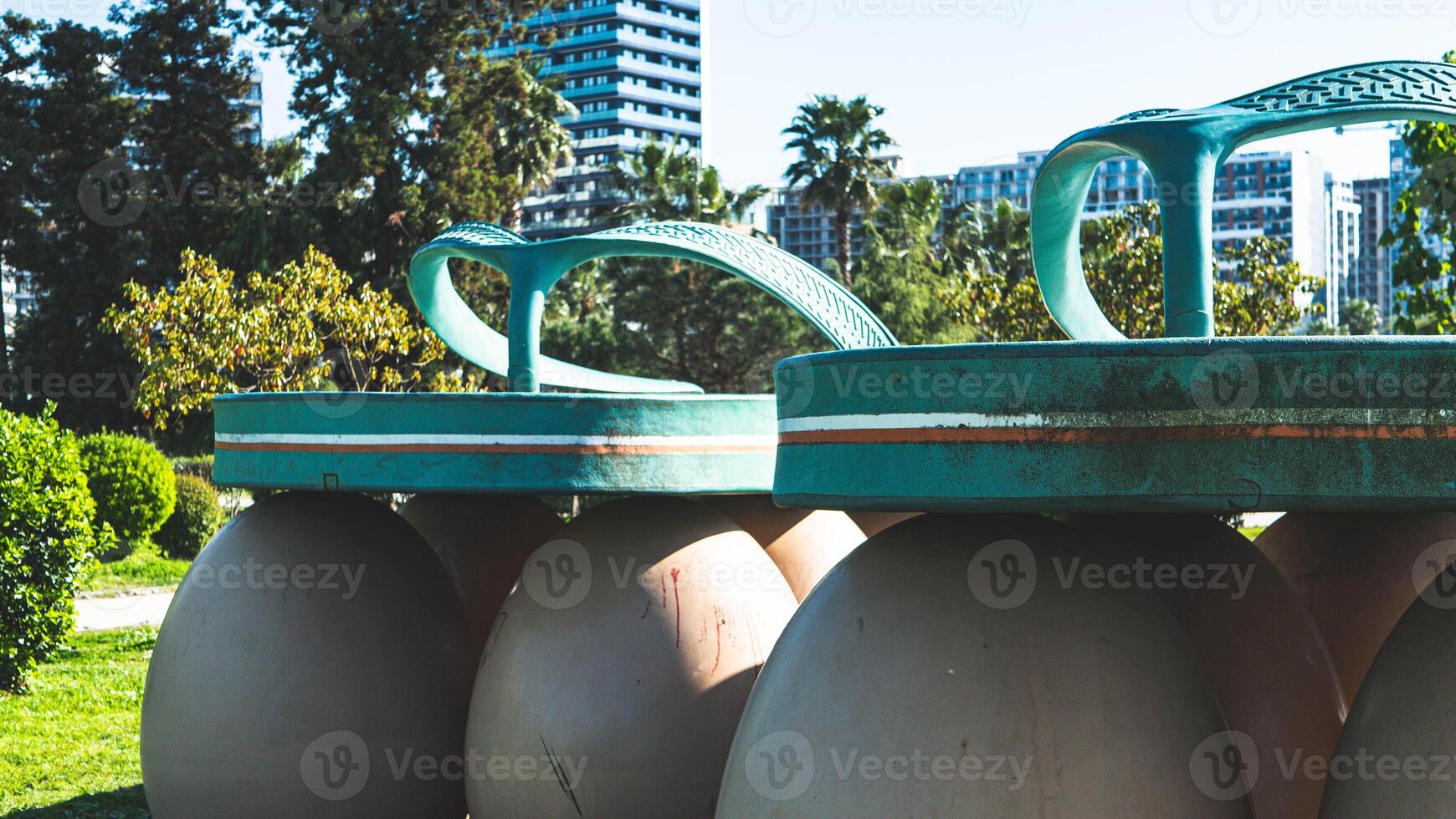 Art object in batumi georgia green sandal flip flop on eggs photo
