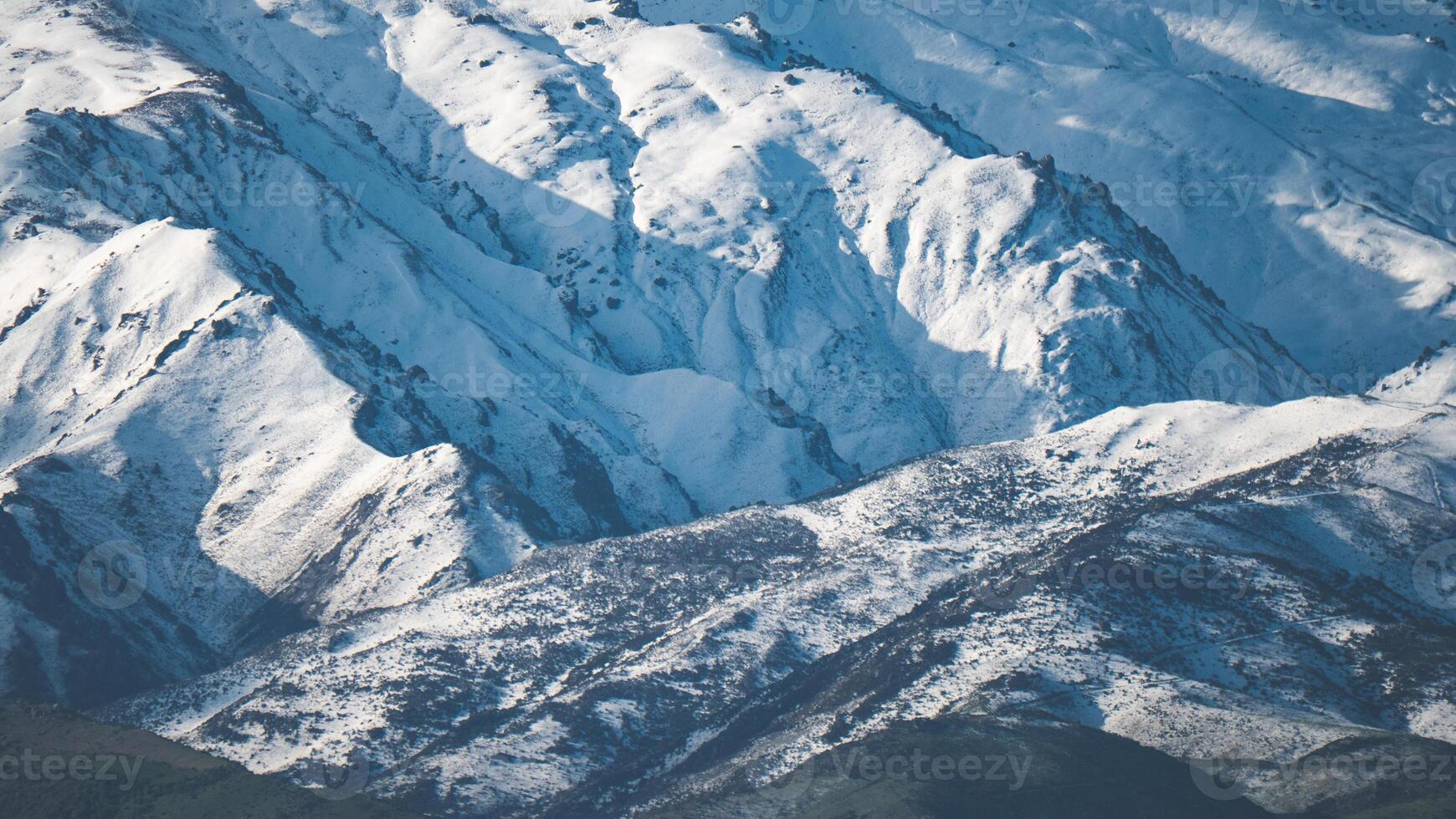 Snow covered mountains close up in Alexandra new Zealand iconic scenery photo