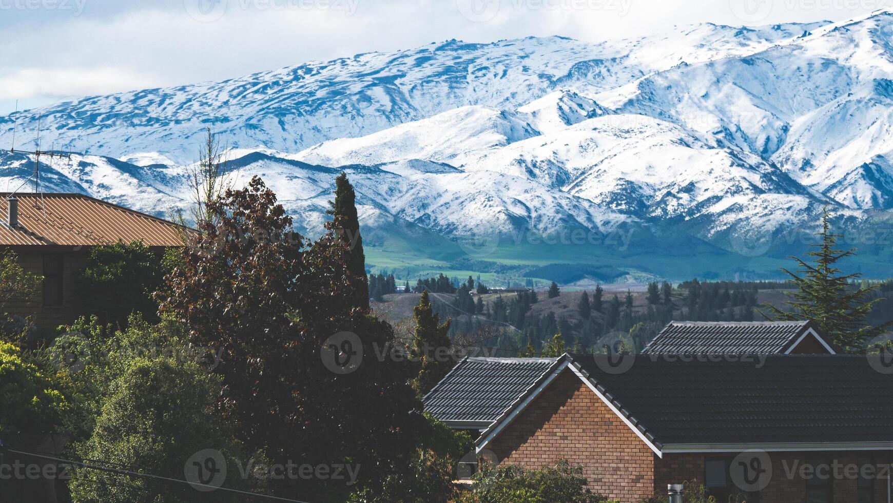 Snow covered mountains close up in Alexandra new Zealand iconic scenery photo
