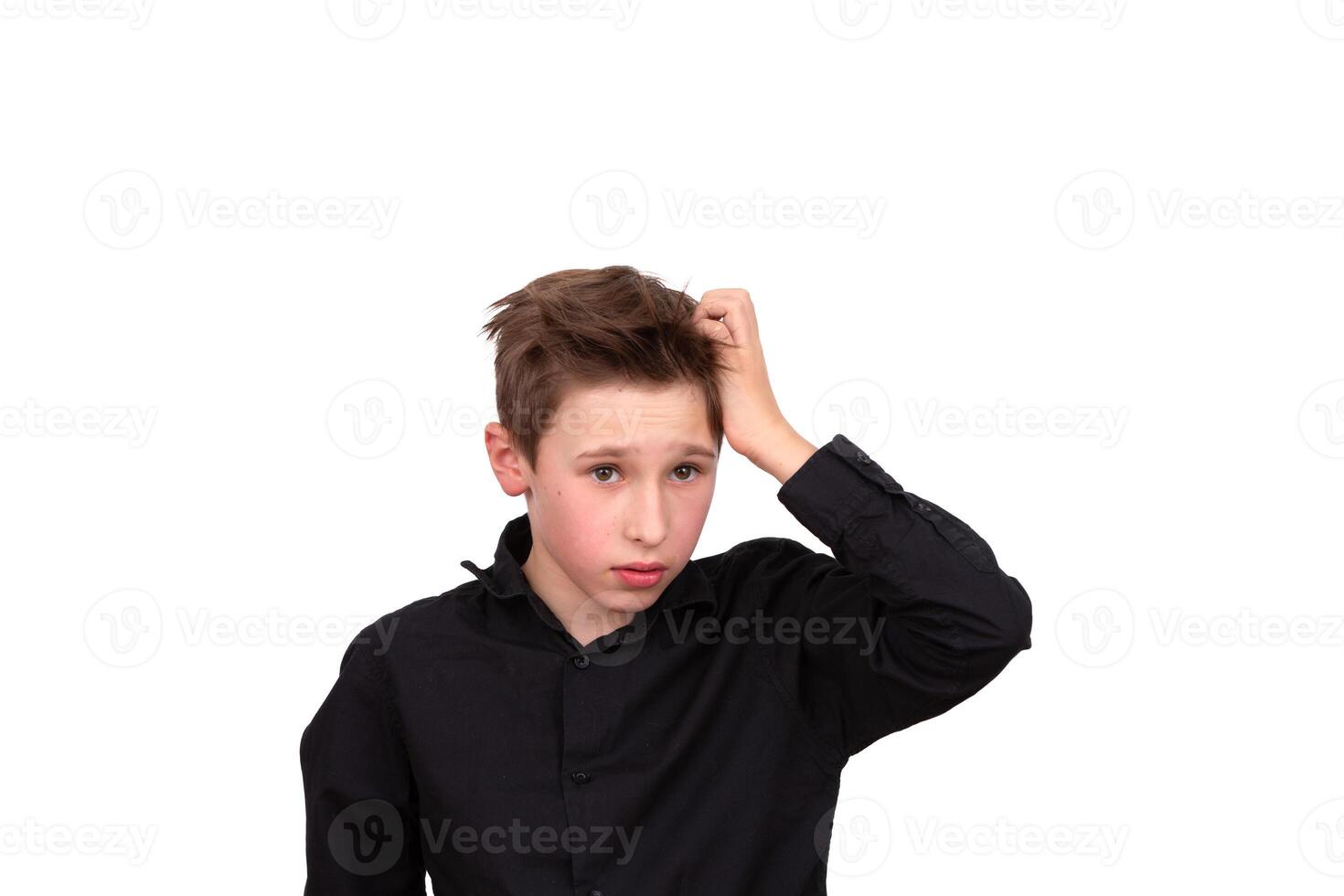 I have no idea. Portrait of a confused boy, feeling insecure, not knowing the answer. photo