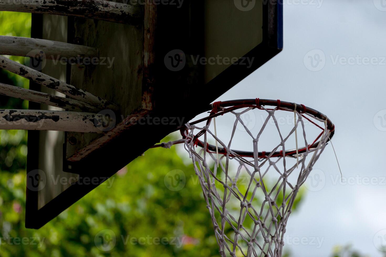 A basketball hoop with a net hanging from it photo