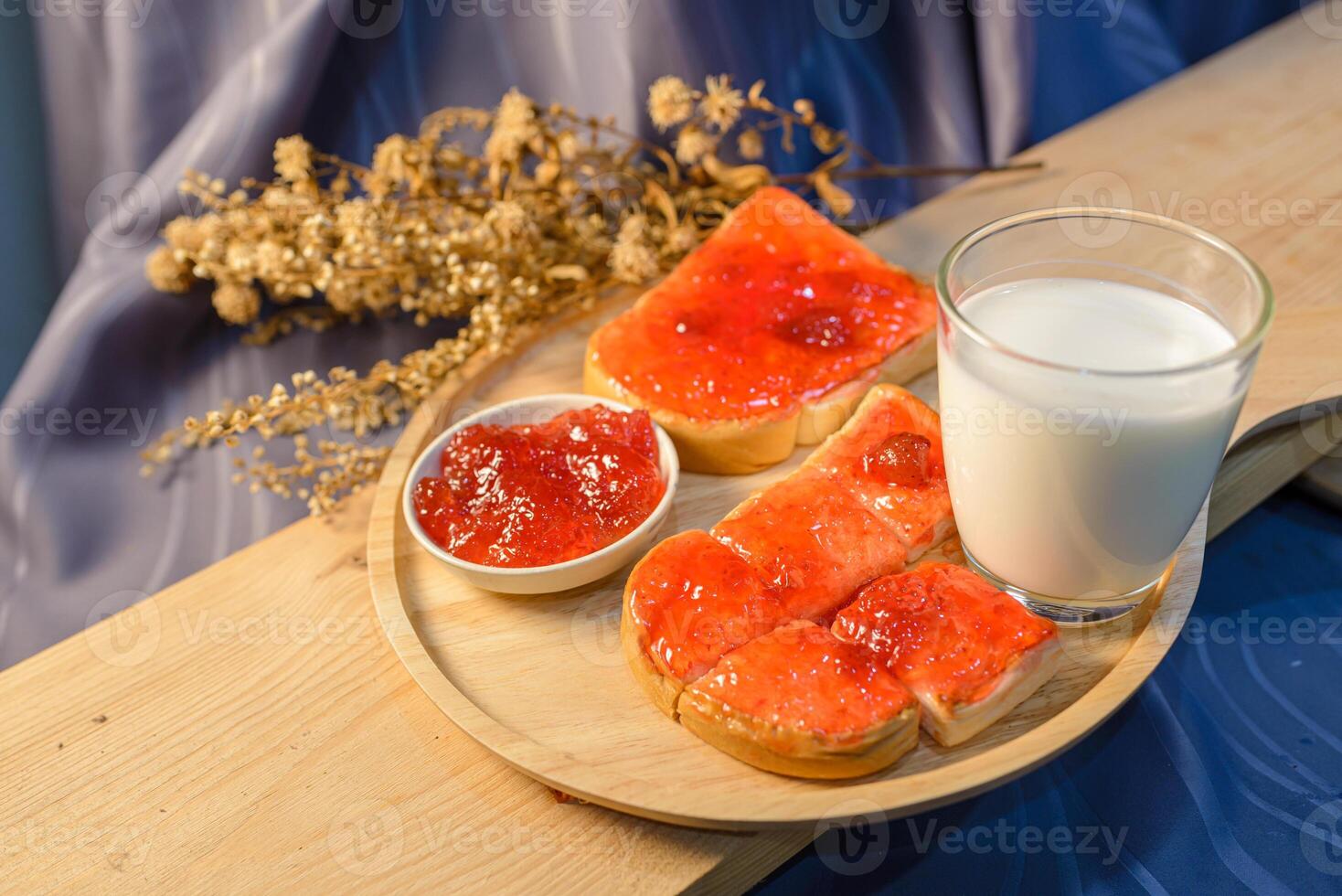 A plate with bread and jam on it photo