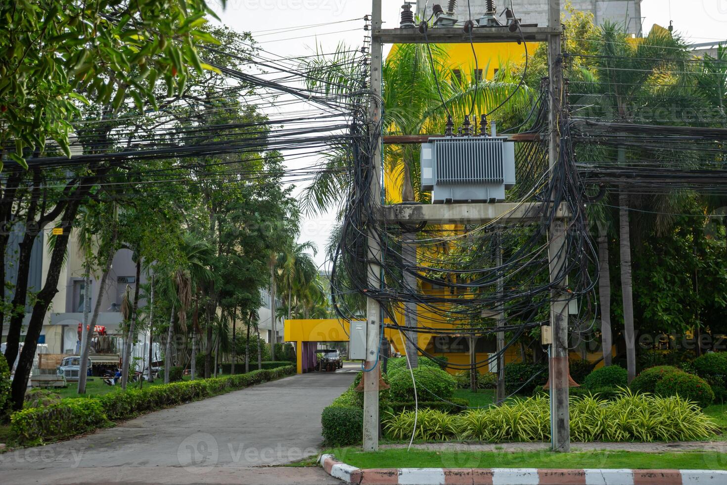 A tall building with yellow and green trim photo