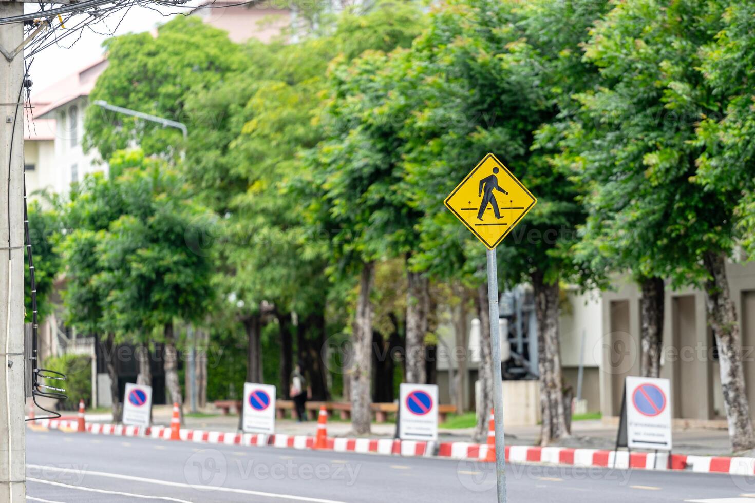 A street with a yellow sign on it photo