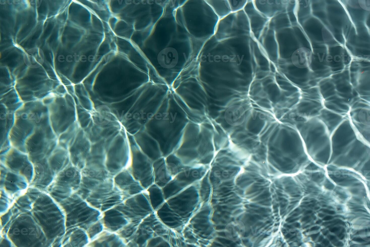 Water surface with ripples and reflections photo