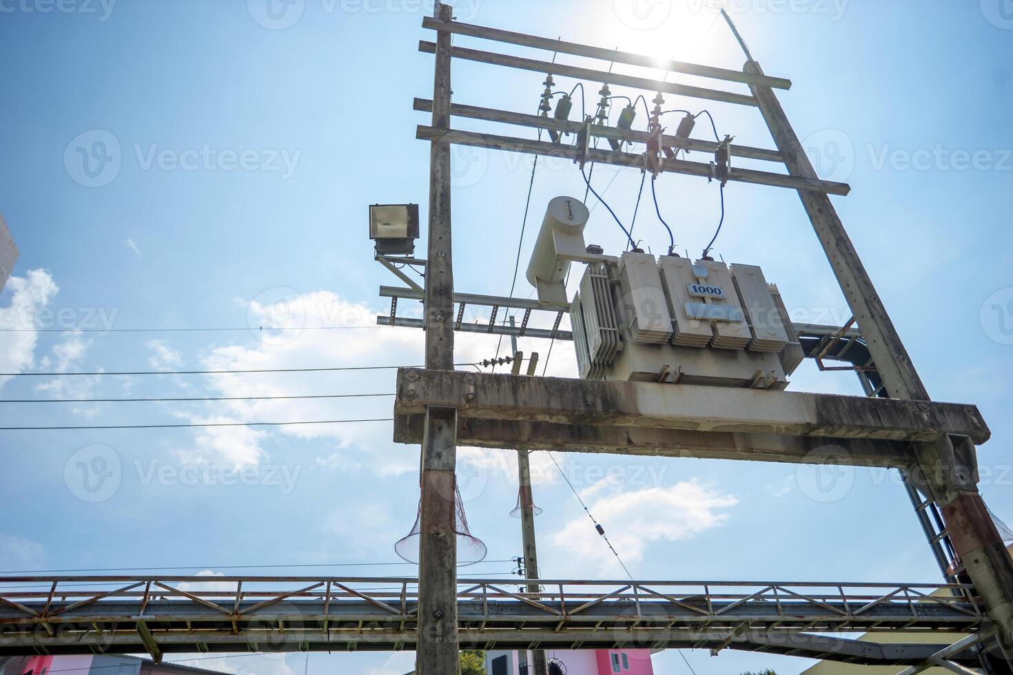 A power pole with wires and a blue sky photo