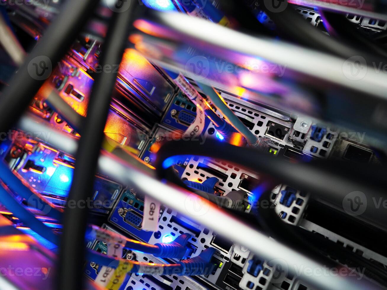 A close up of a computer server with many wires photo