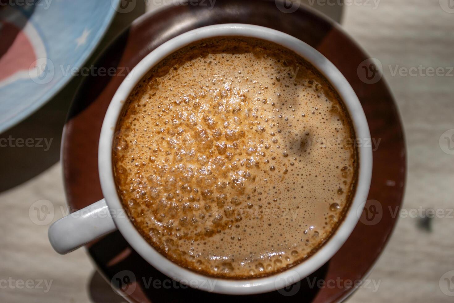 A cup of coffee on a saucer photo