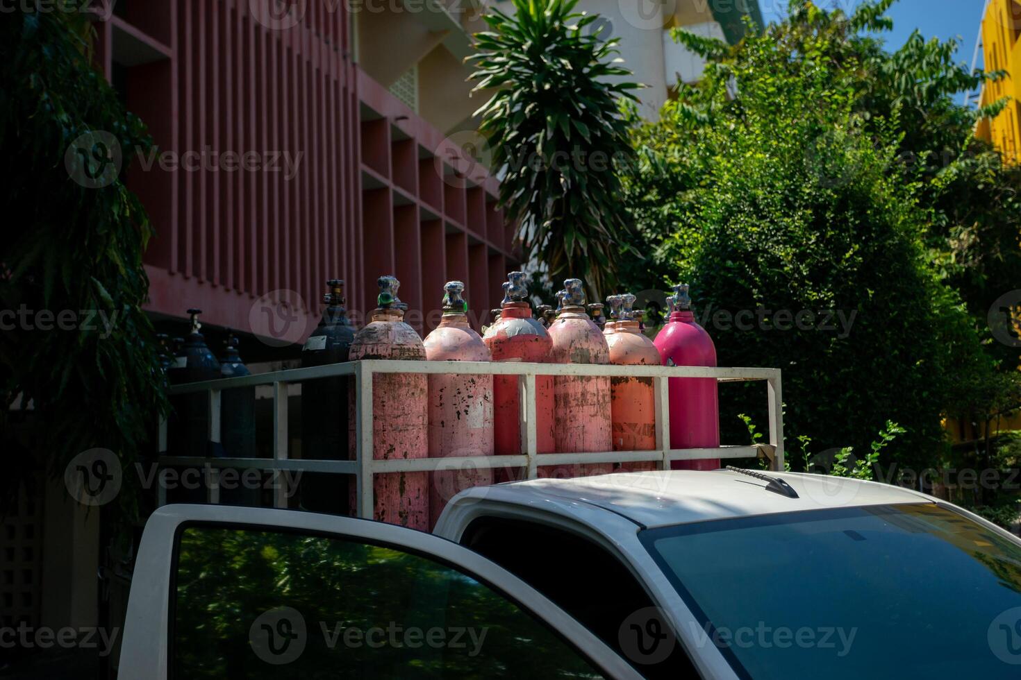 A white truck with a rack of cylinders photo