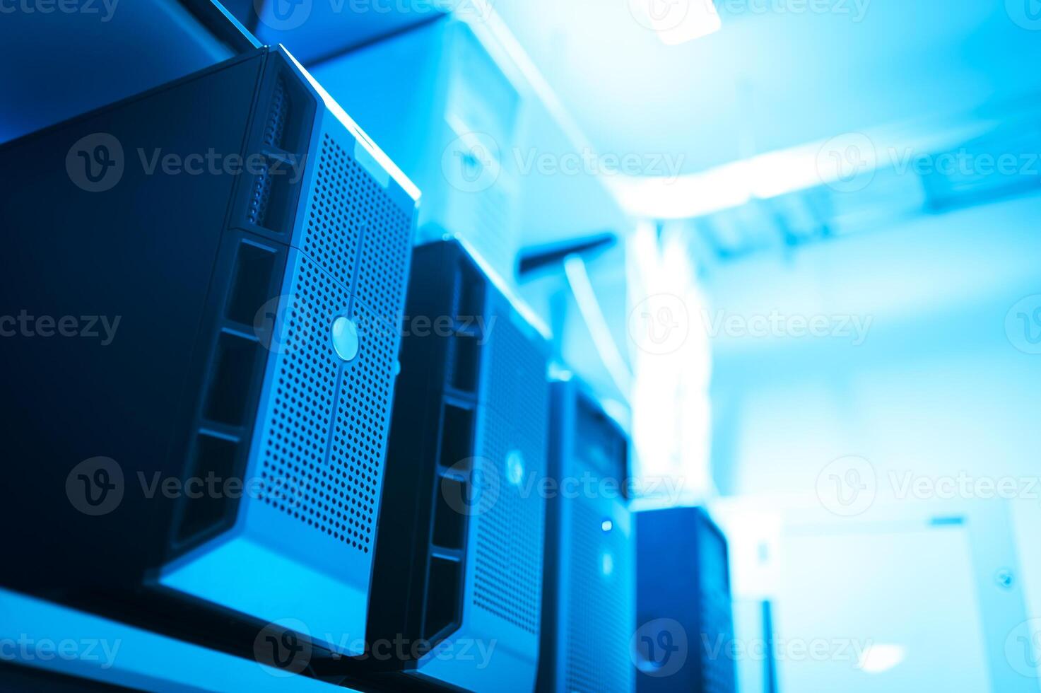 A row of computer servers in a room photo