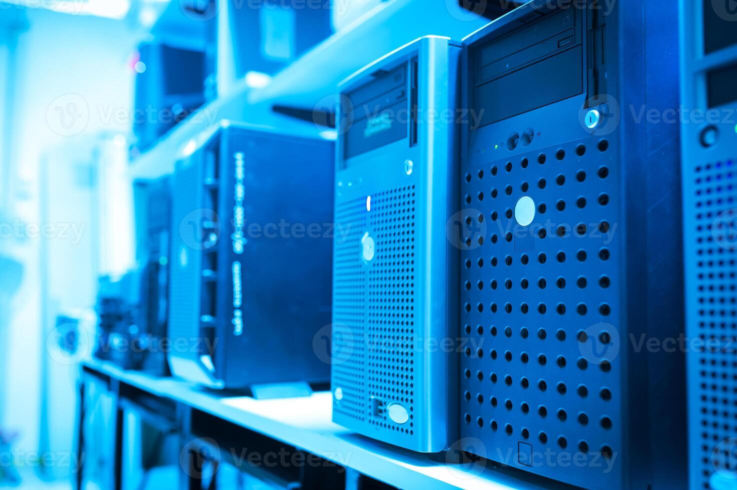 A row of computer servers in a room photo