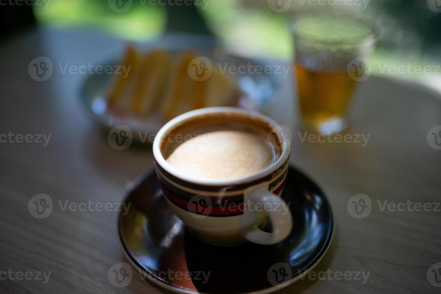 A cup of coffee on a table photo