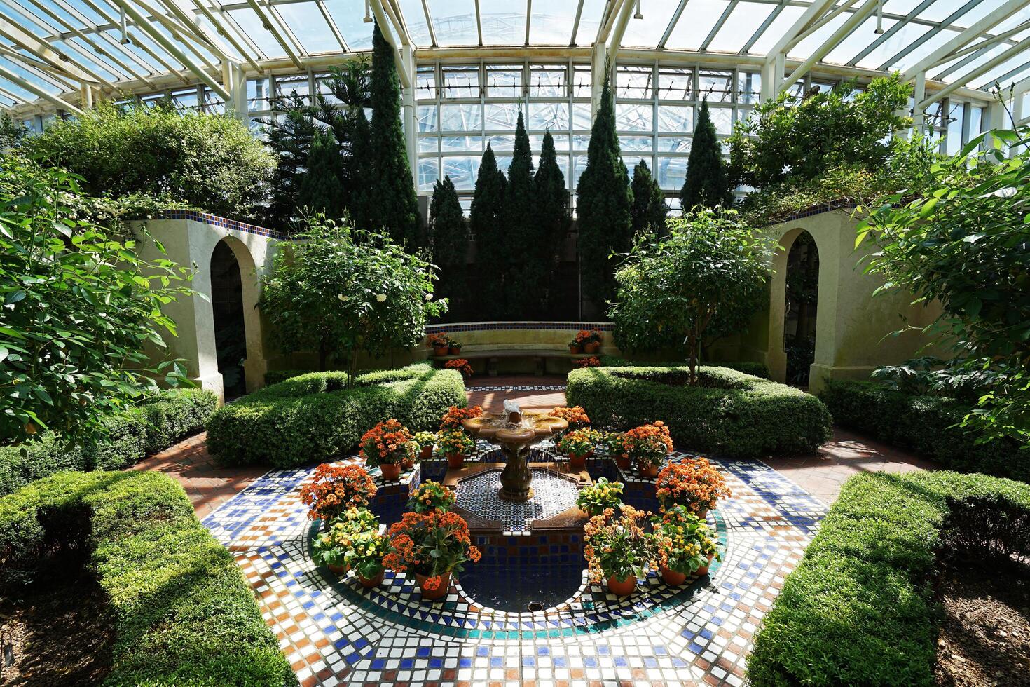 Architecture of terrace patio and natural fountain decorated in Climatron geodesic conservatory dome at Missouri Botanical garden- St.Louis town, MO photo