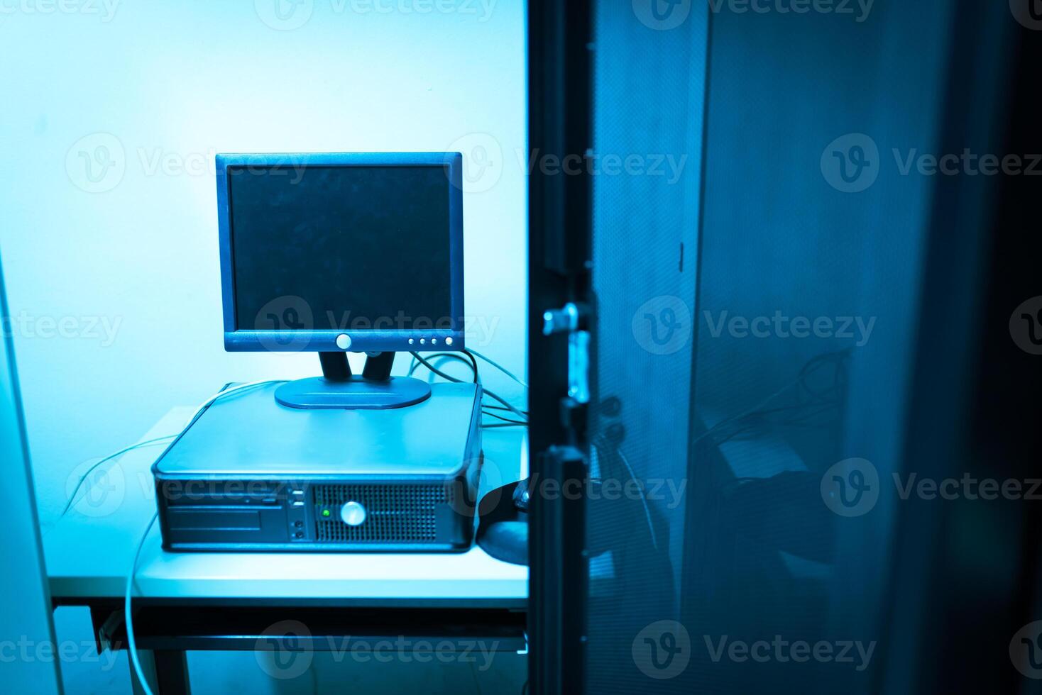 A computer monitor sitting on top of a desk photo