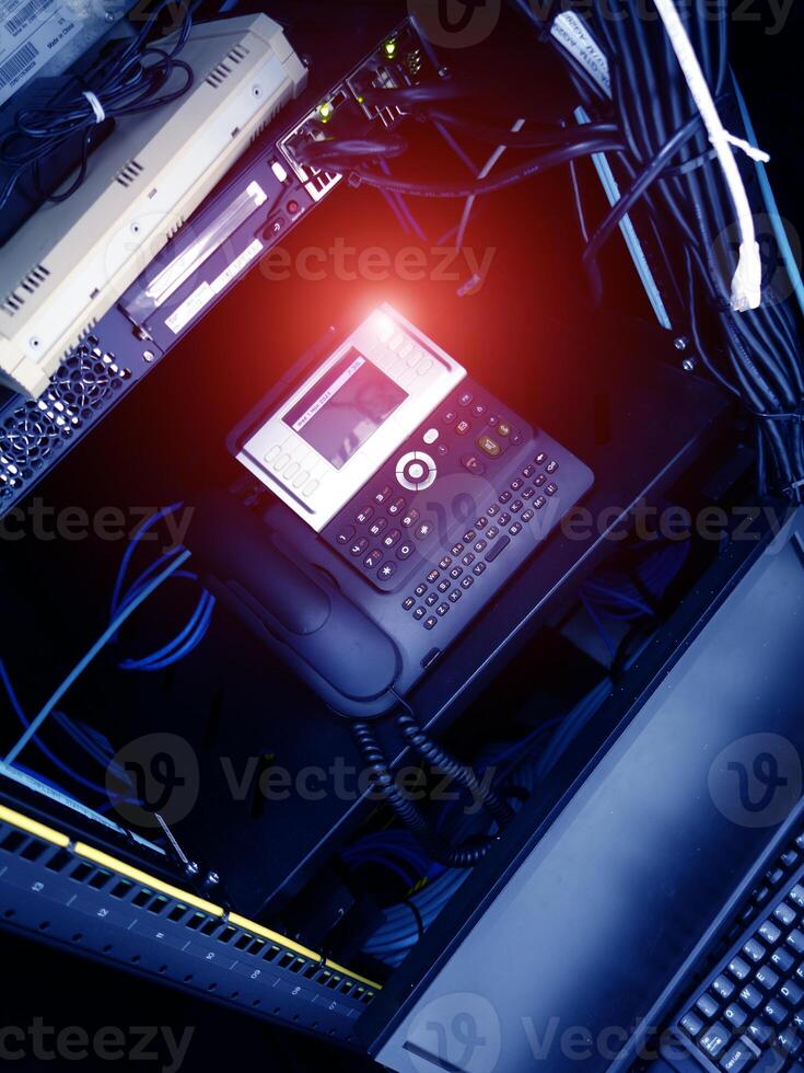 A computer with a phone and a keyboard photo