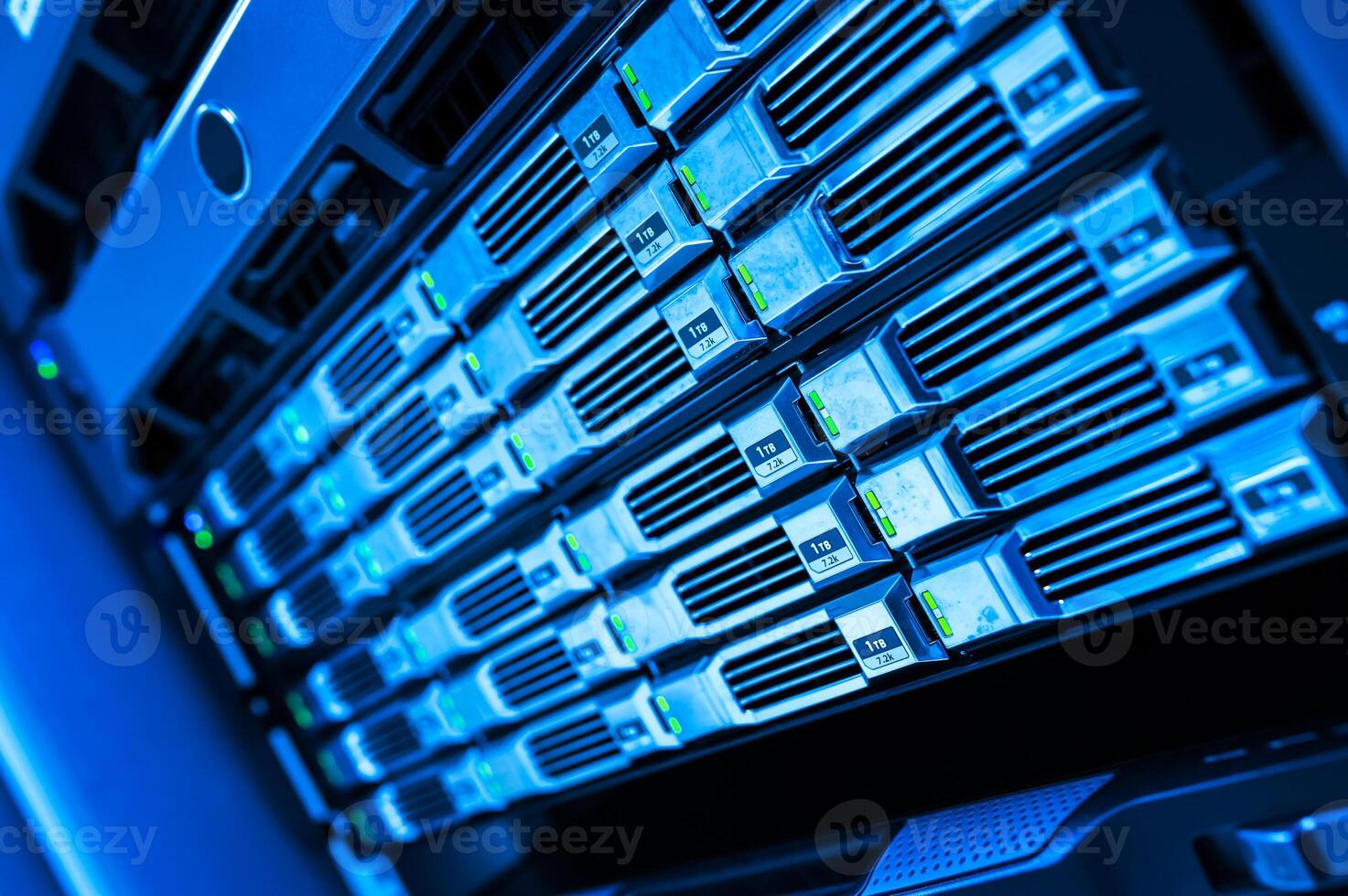 A close up of a server rack with many servers photo