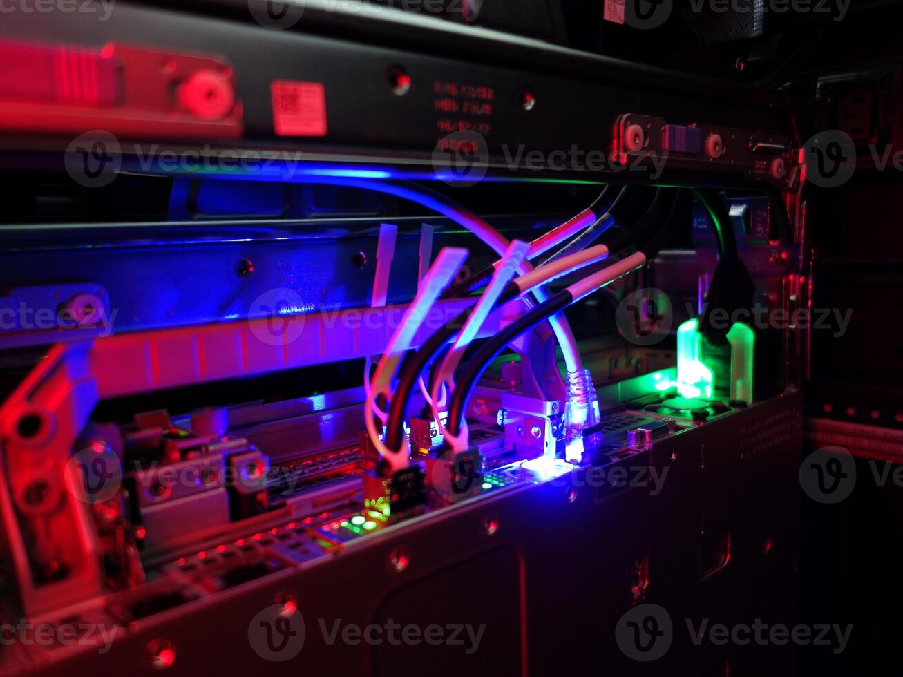 A computer with a blue and red light photo