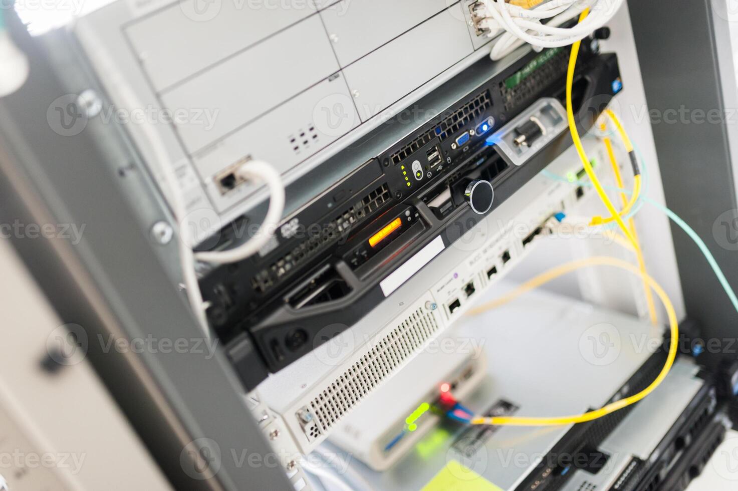 A server rack with multiple wires connected to it photo
