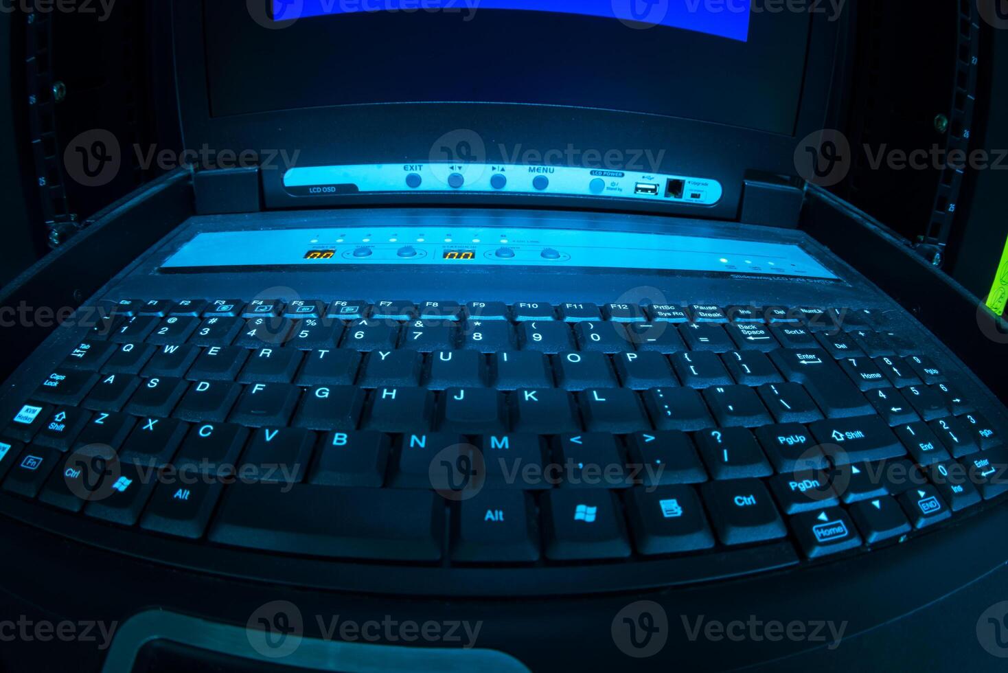 A laptop computer with a keyboard and a blue screen photo