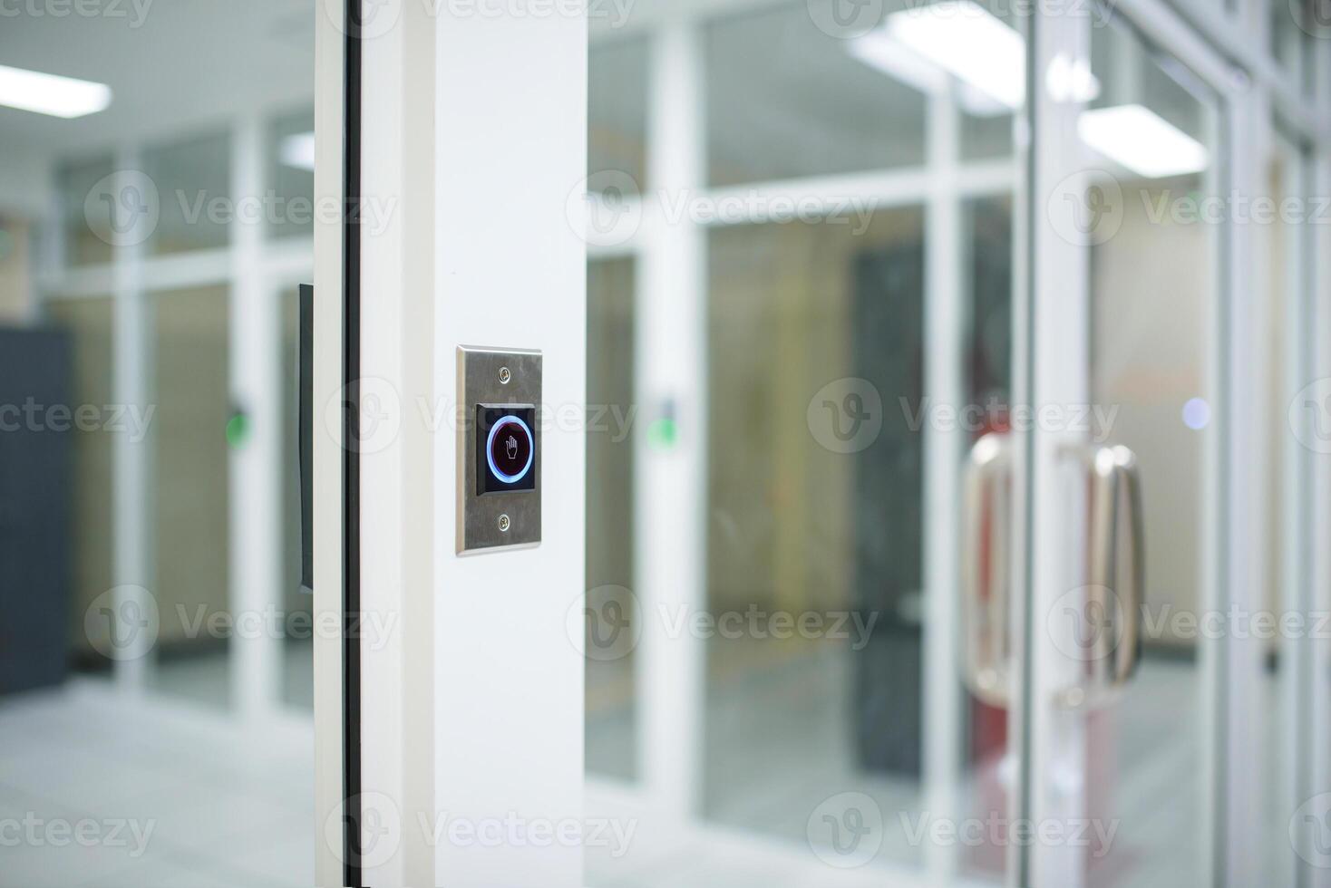 A door with a button on it in a room photo