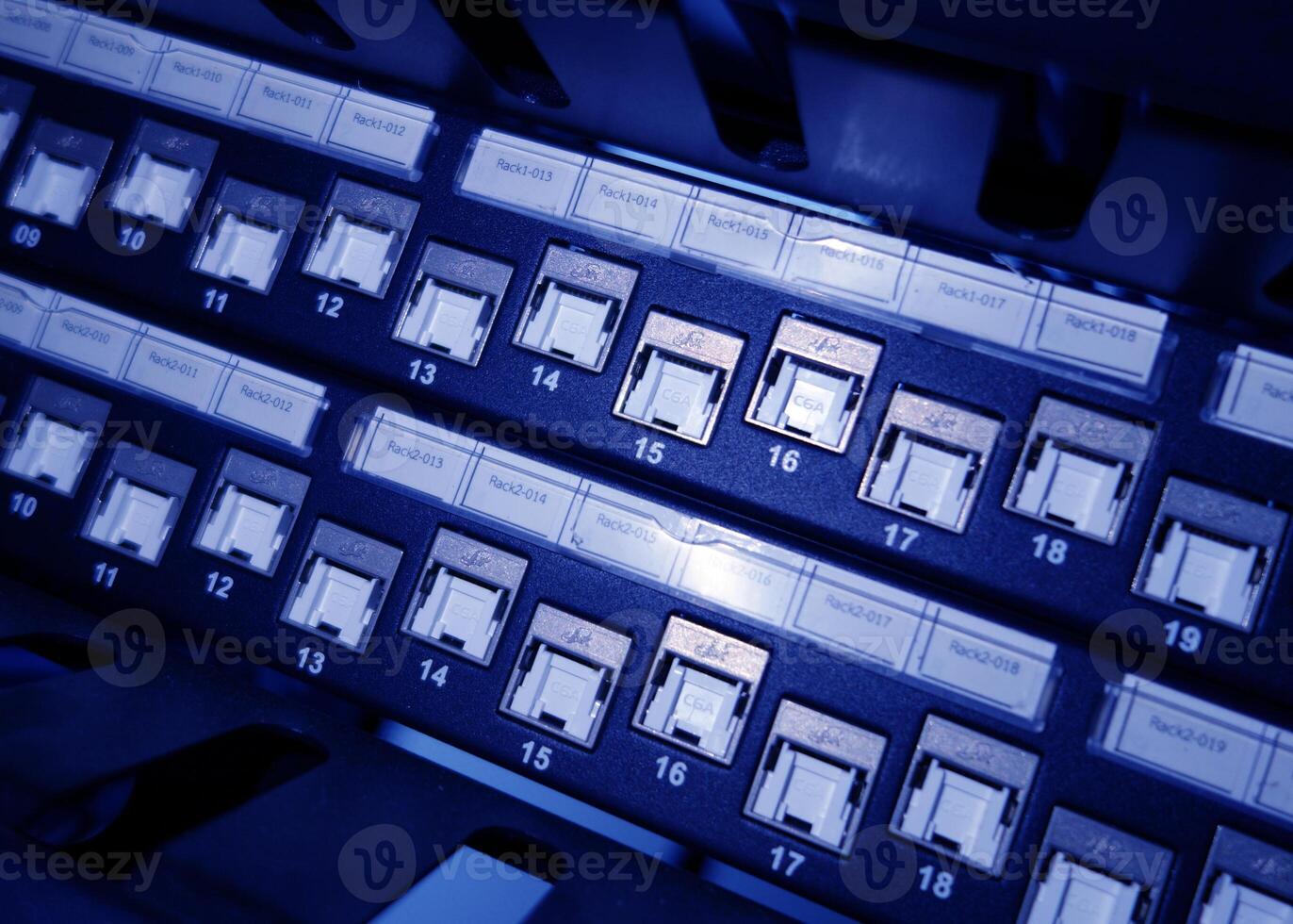 A close up of a computer panel with many switches photo