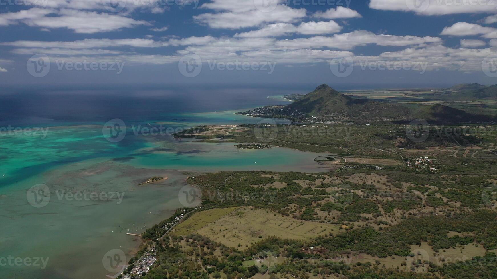 The view from the bird's eye view of the fishing village and the mountains. Indian ocean. Mauritius photo