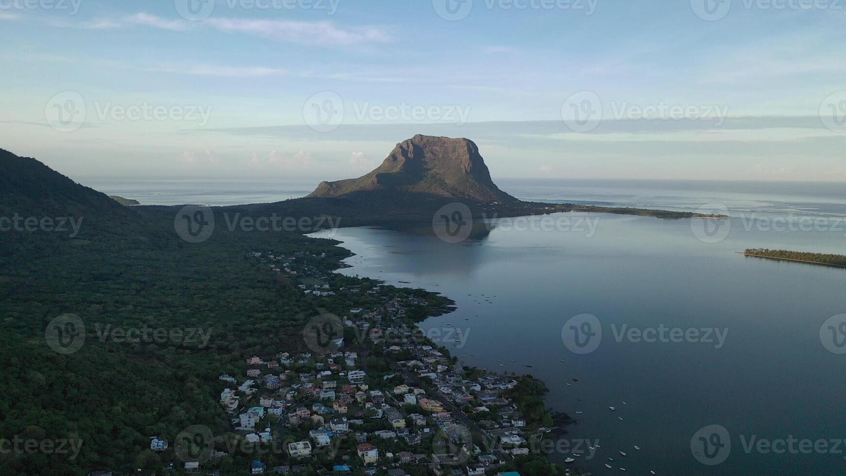 Beautiful bird's-eye view of mount Le Morne Brabant and the waves of the Indian ocean in Mauritius.Underwater waterfall near mount Le Morne in the Indian ocean photo