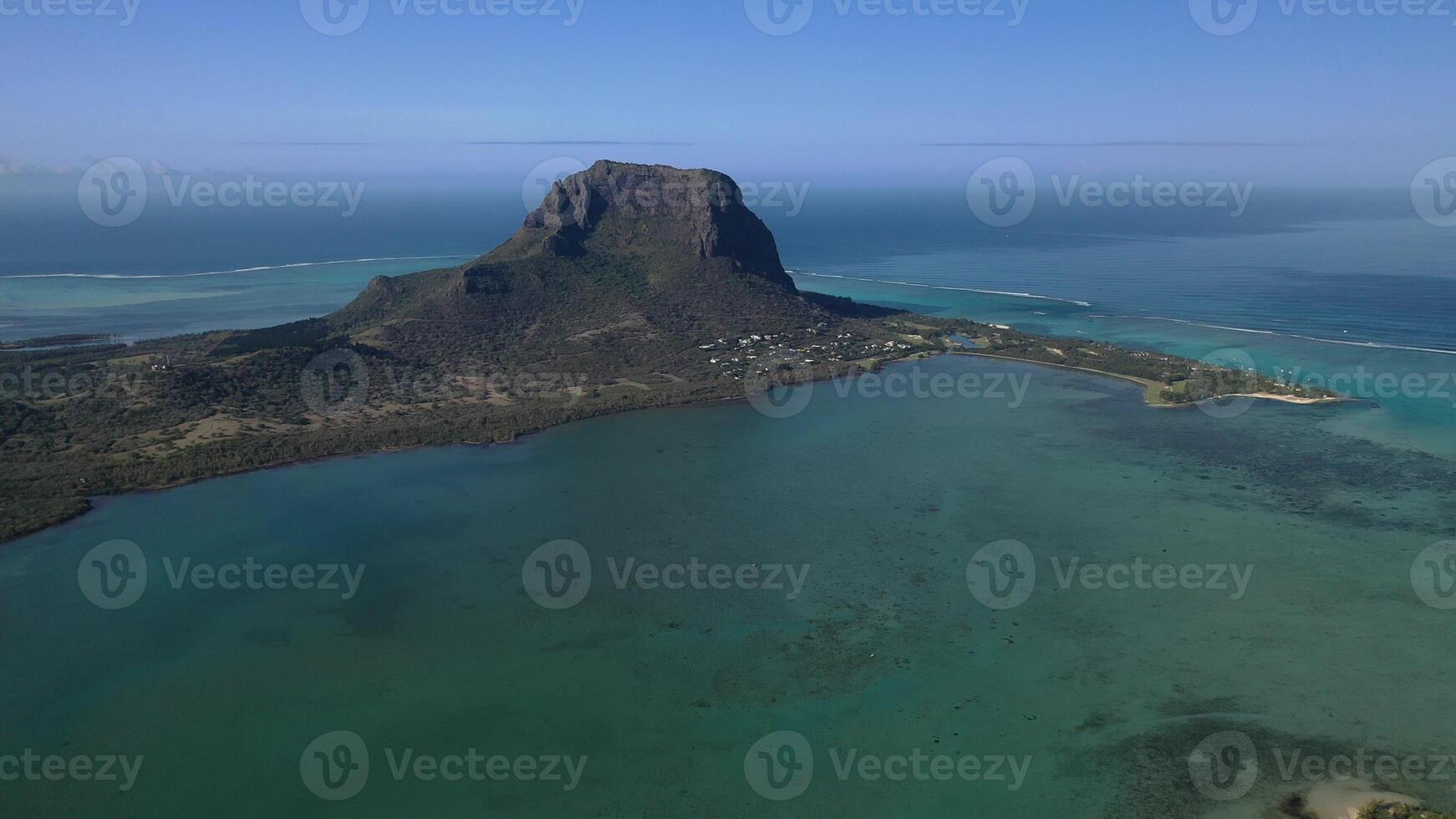 Beautiful bird's-eye view of mount Le Morne Brabant and the waves of the Indian ocean in Mauritius.Underwater waterfall near mount Le Morne in the Indian ocean photo