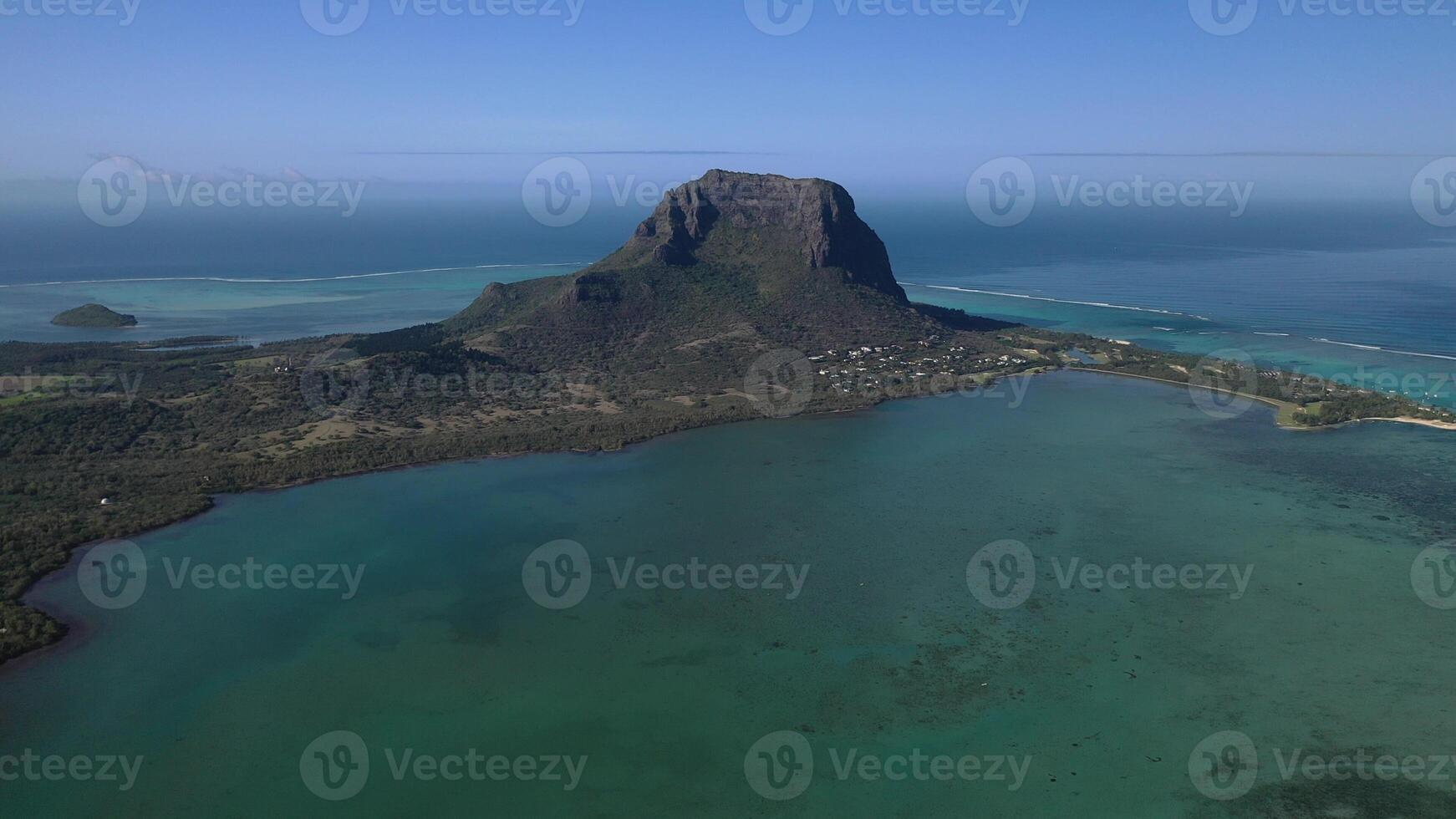 Beautiful bird's-eye view of mount Le Morne Brabant and the waves of the Indian ocean in Mauritius.Underwater waterfall near mount Le Morne in the Indian ocean photo