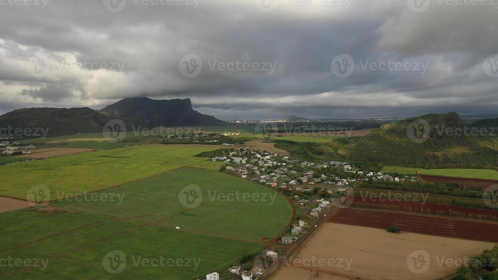 Aerial photography of the beautiful green countryside of Mauritius with fields and mountain views photo